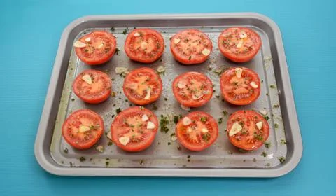 Tomatoes on a baking tray ready for roasting Stock Photos