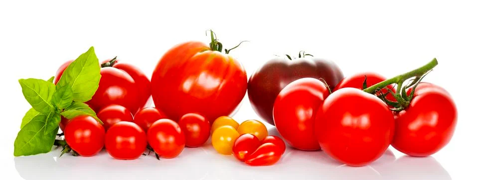 Tomatoes with basil Stock Photos