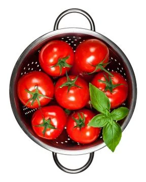 Tomatoes with basil Stock Photos