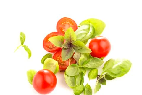 Tomatoes with basil on white background Foto stock