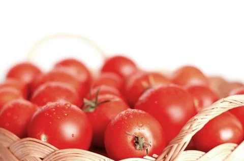 Tomatoes in basket Stock Photos