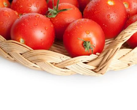 Tomatoes in basket Stock Photos