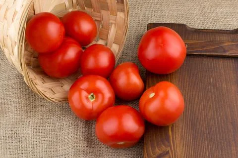 Tomatoes in basket Stock Photos