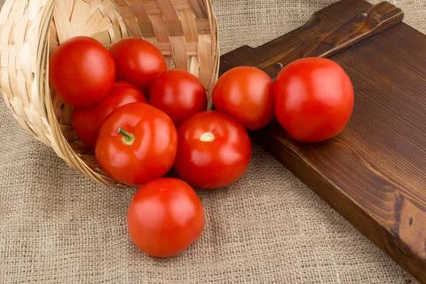 Tomatoes in basket Stock Photos