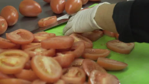 Tomatoes being washed and cut Stock Footage 142160246