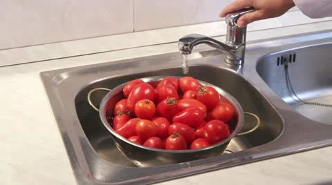 Tomatoes being washed under running water 스톡 동영상 24672282