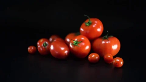 Tomatoes on black background, panning, shallow Depth of field 스톡 동영상 75780355