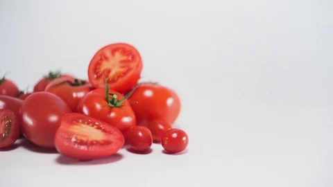 Tomatoes on black background, sliding Video stock 75784210