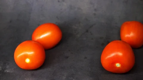 Tomatoes on a black background. vegetables on black background. Stock Footage 99587076