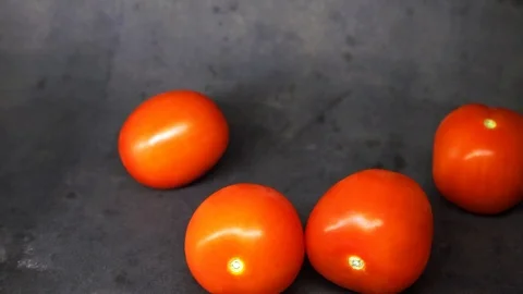 Tomatoes on a black background. vegetables on black background. Stock Footage 99587080