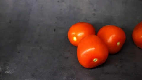 Tomatoes on a black background. vegetables on black background. Stock Footage 99587102