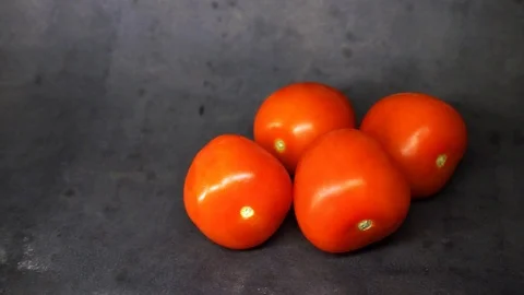Tomatoes on a black background. vegetables on black background. Stock Footage 99587110