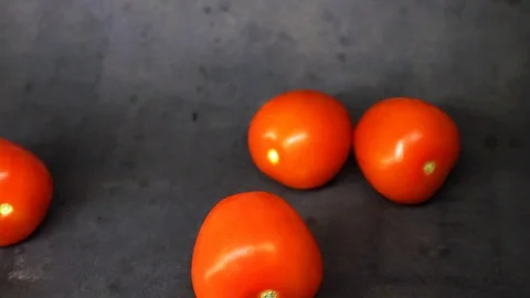 Tomatoes on a black background. vegetables on black background. Stock Footage 99587115