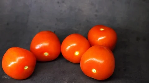 Tomatoes on a black background. vegetables on black background. Stock Footage 99587121