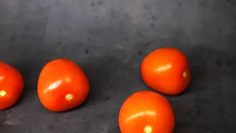 Tomatoes on a black background. vegetables on black background. Stock Footage 99587124