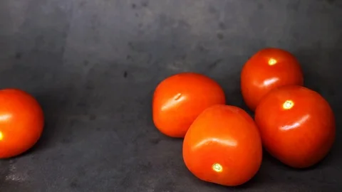 Tomatoes on a black background. vegetables on black background. Stock Footage 99587134