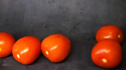Tomatoes on a black background. vegetables on black background. Stock Footage 99587136
