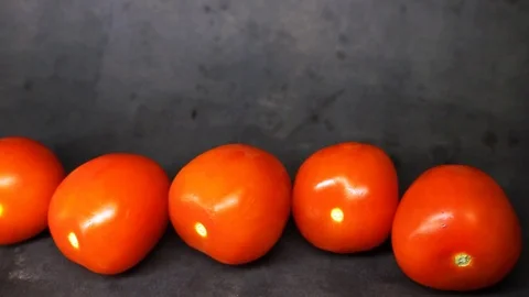 Tomatoes on a black background. vegetables on black background. Stock Footage 99587137