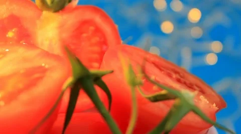 Tomatoes - blue background - turning - 01 Stock Footage 62402439