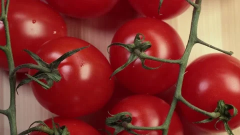 Tomatoes on a branch, cutting board. Stock Footage 228245850