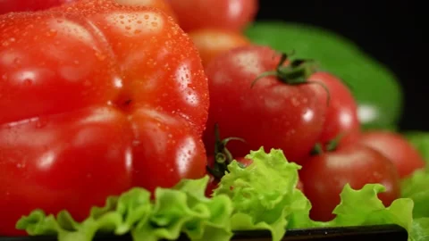 Tomatoes cherry pepper and salad rotate on a plate. Stock Footage 137575116