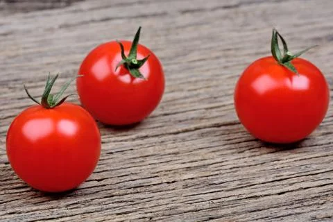 Tomatoes cherry on rustic table Stock Photos