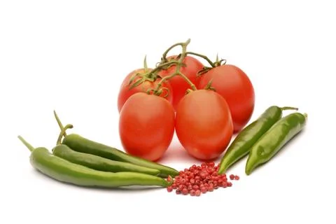 Tomatoes, chilli and pepper on white background Stock Photos