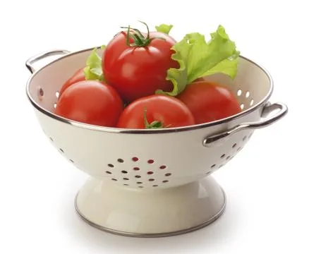 Tomatoes in the colander Stock Photos