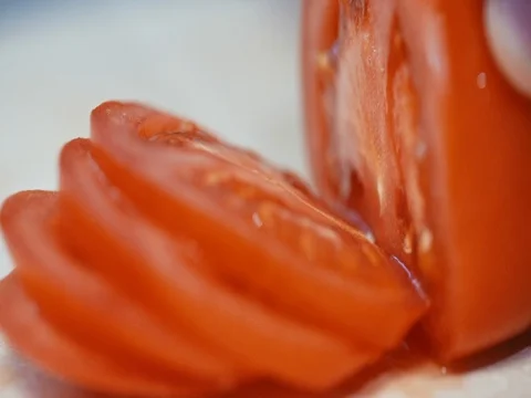 Tomatoes cut into the Board, close-up. slow motion Stock Footage 73712466