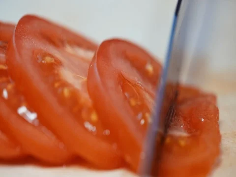 Tomatoes cut into the Board, close-up. slow motion Vidéo 73712952