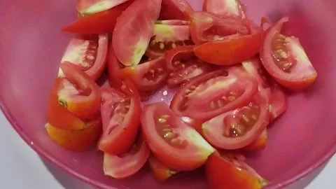 Tomatoes cut into small pieces Stock Footage 219214750