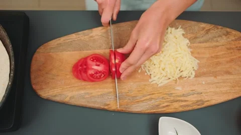 Tomatoes cut into thin rings with a knife Stock Footage 252298000