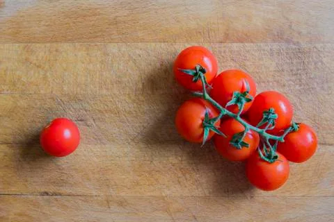 Tomatoes on cutting board Stock Photos