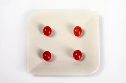 Tomatoes as dice isolated on white Stock Illustration