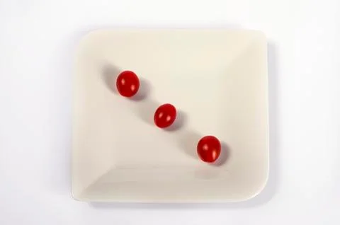 Tomatoes as dice isolated on white Stock Illustration