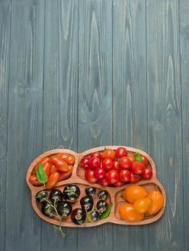 Tomatoes different varieties. Many different tomato in summer day. Stock Photos