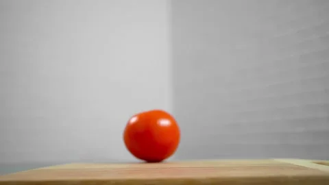 Tomatoes fall and roll towards each other Stock Footage 196725815
