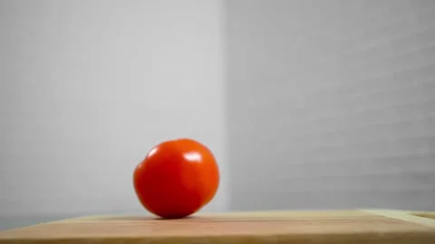 Tomatoes fall and roll towards each other Stock Footage 196725828