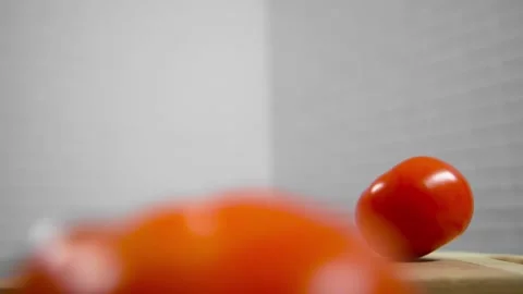 Tomatoes fall and roll towards each other Stock Footage 196725838