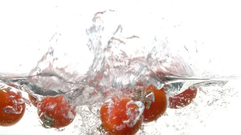 Tomatoes falling into the water Stock Footage 123654670