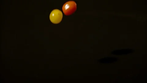 Tomatoes falling on a wet surface, Ultra Slow Motion Video stock 86699511