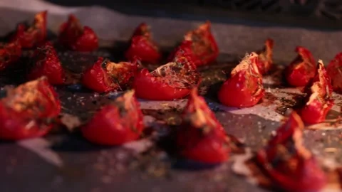 Tomatoes with garlic, basil and spices are dried in the oven Stock Footage 201756349