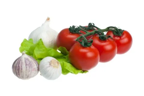 Tomatoes, garlic, lettuce Stock Photos
