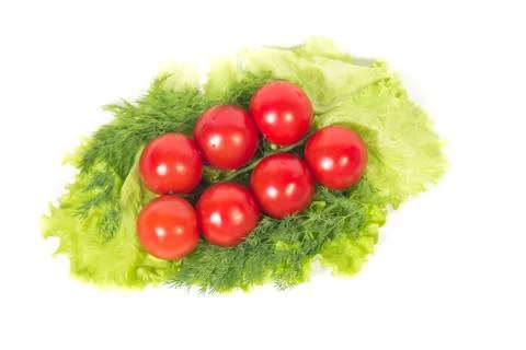 Tomatoes on the green Stock Photos