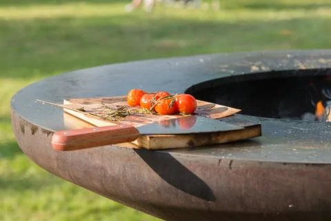 Tomatoes on the grill pan  the table Stock Photos