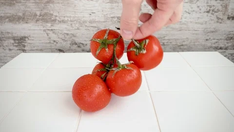 Tomatoes hands movement kitchen Stock Footage 128981537