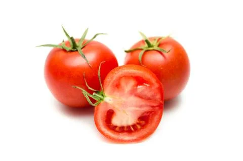 Tomatoes isolated on white. With clipping path. Stock Photos
