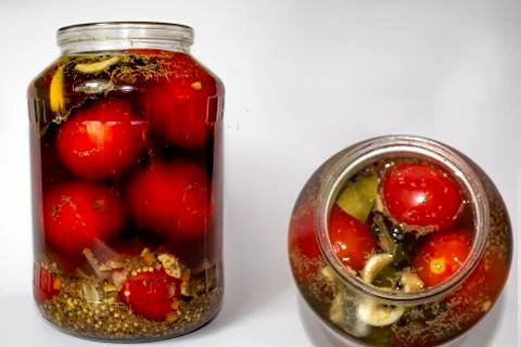 Tomatoes in a jar Stock Photos
