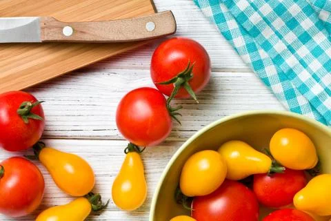 Tomatoes on kitchen table Stock Photos