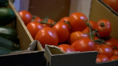 Tomatoes in market stall Stock Footage 128351474